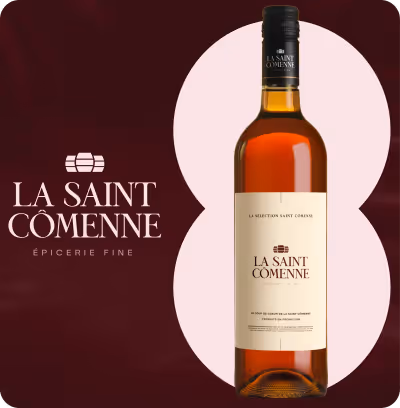 Bouteille d'épicerie fine La Saint Cômenne avec étiquette crème sur fond bordeaux et cercle rose pâle.